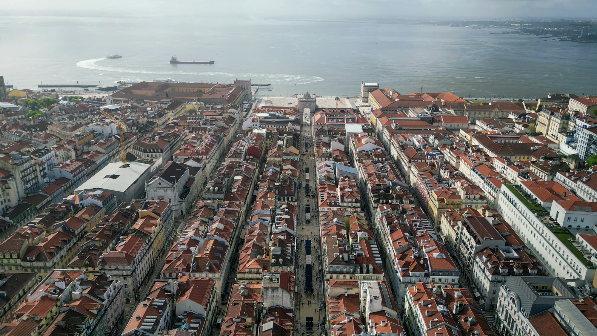 Lisbon skyline by the waterfront with ships in the background. Portugal